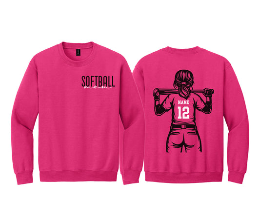A pink sweatshirt with a graphic of a female softball player and the text "SOFTBALL" printed on the front.